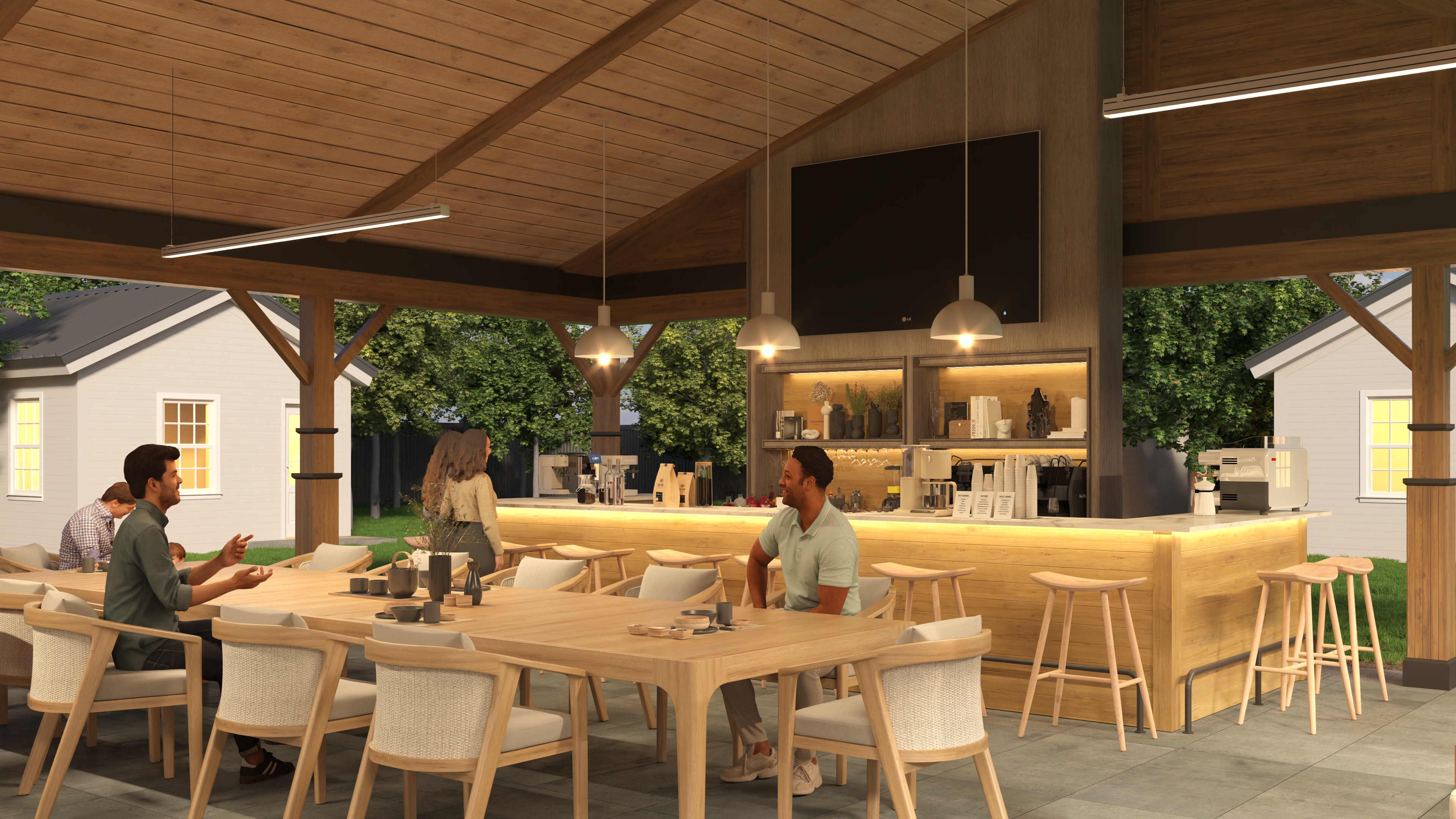 Guests inside the pavillion around a table and next to the bar